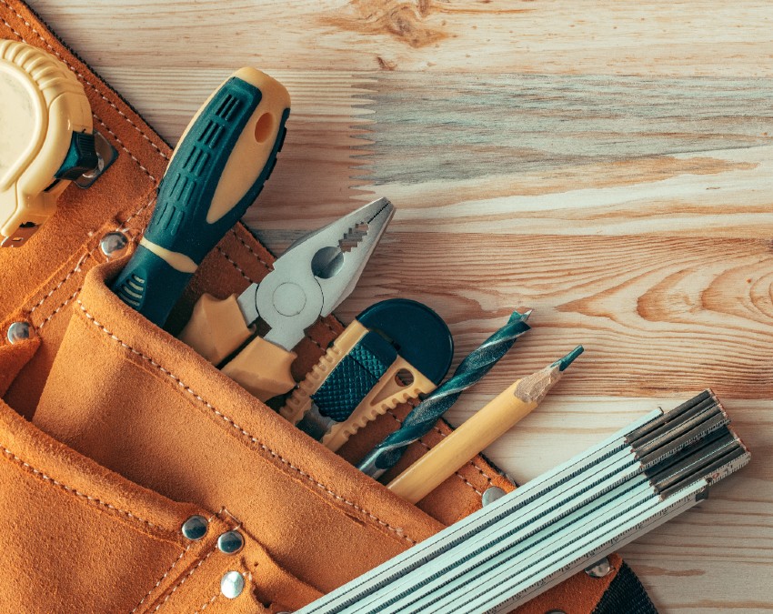 Tool belt with pliers, screwdrivers, and drill bits used for handyman services in Arcadia, CA.